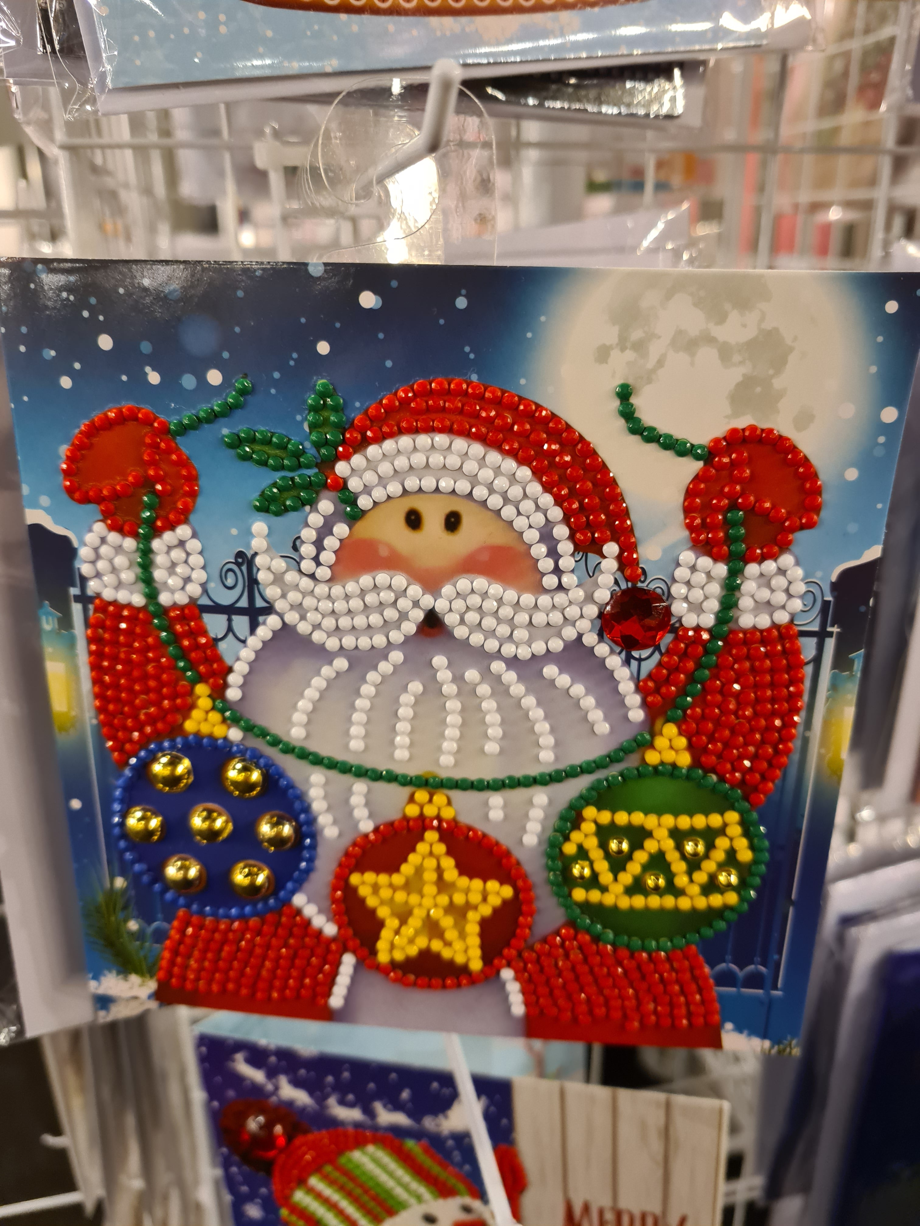 Kerstkaart Kerstman met Ballenslinger